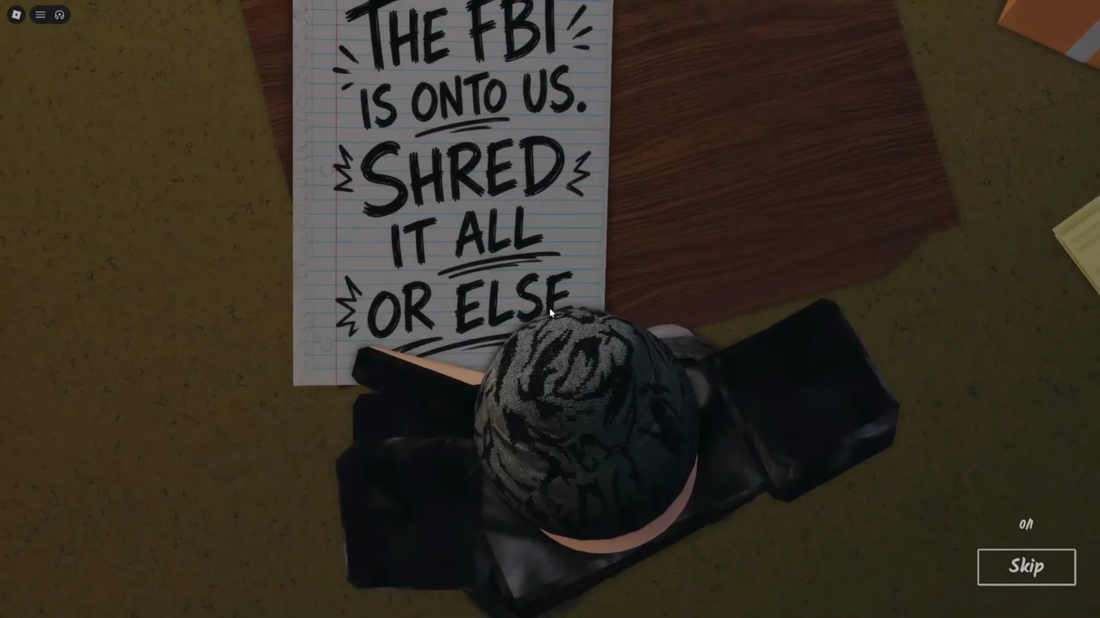 Shred the Secrets Room 1 opening note held up to the camera reading THE FBI IS ONTO US SHRED IT ALL OR ELSE over the tutorial desk